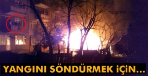 Yangını söndürmek için su bidonu fırlattı